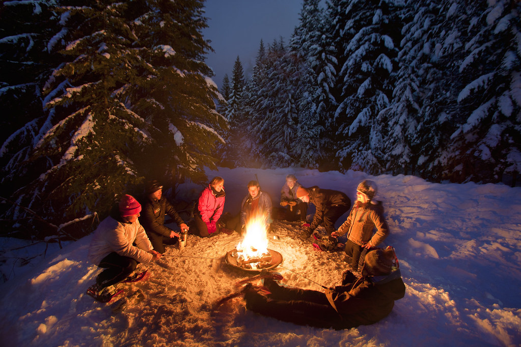 Outdoor Comfort round a campfire in winter snow