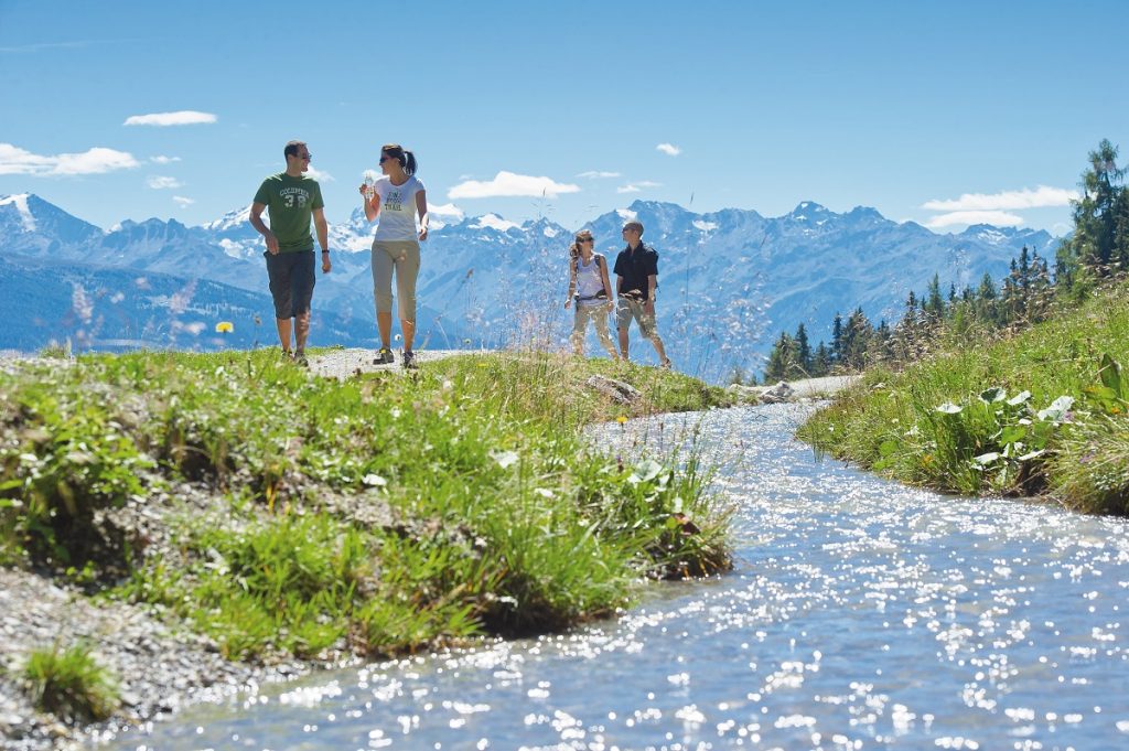 Couples enjoying summer activities in Crans Montana Switzerland