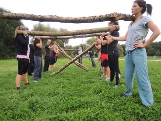 Women at a fitness bootcamp providing group training