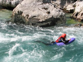Hydrospeeding down river rapids in the French Alps