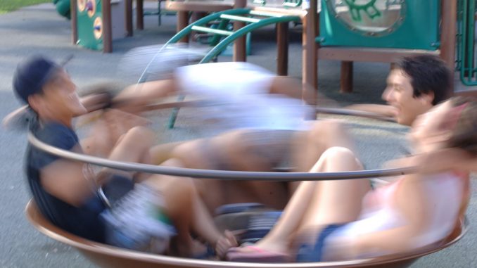 teens enjoy this playground equipment for social spinning