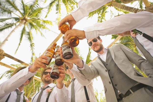 Guys enjoying a beer on a stag do