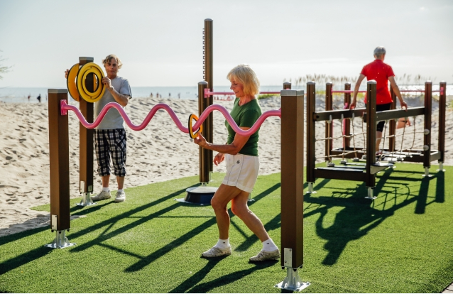 Senior citizens exercising at an outdoor fitness park